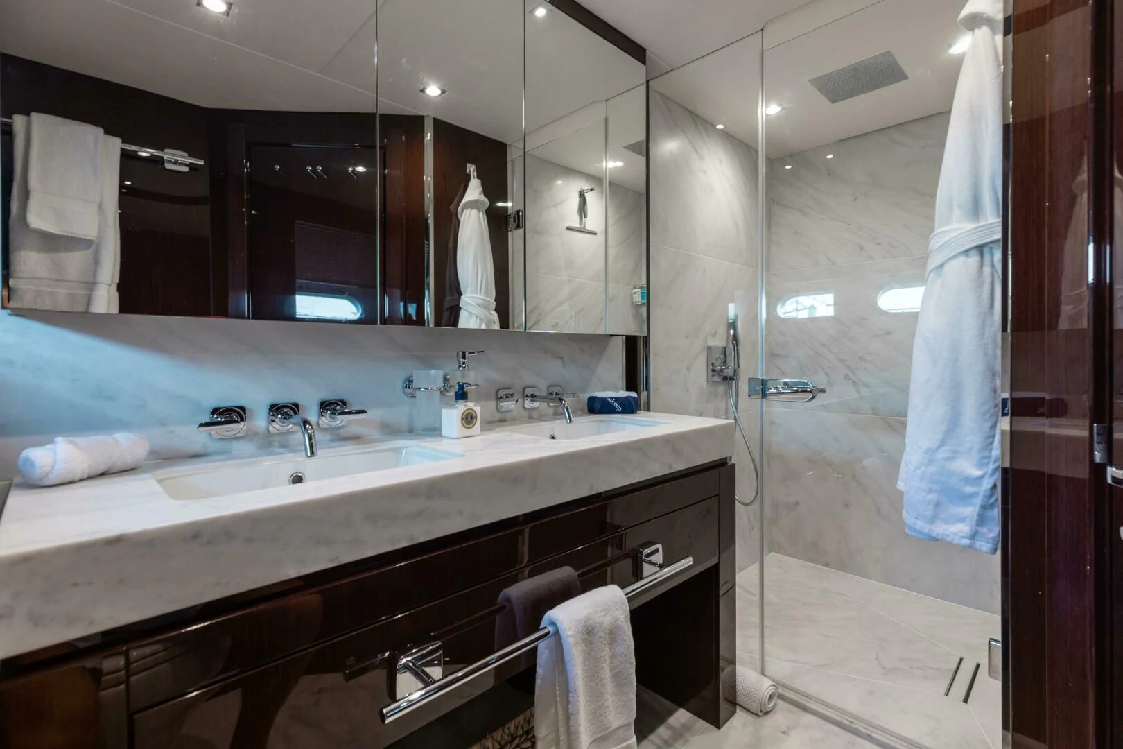 a bathroom with a large mirror aboard MIRRACLE Yacht for Sale
