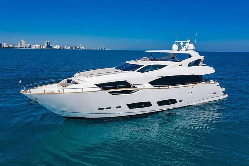 a white yacht in the water aboard MIRRACLE Yacht for Sale