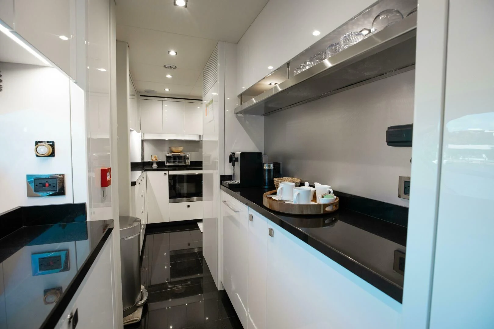 a kitchen with a sink and cabinets aboard MIRRACLE Yacht for Sale
