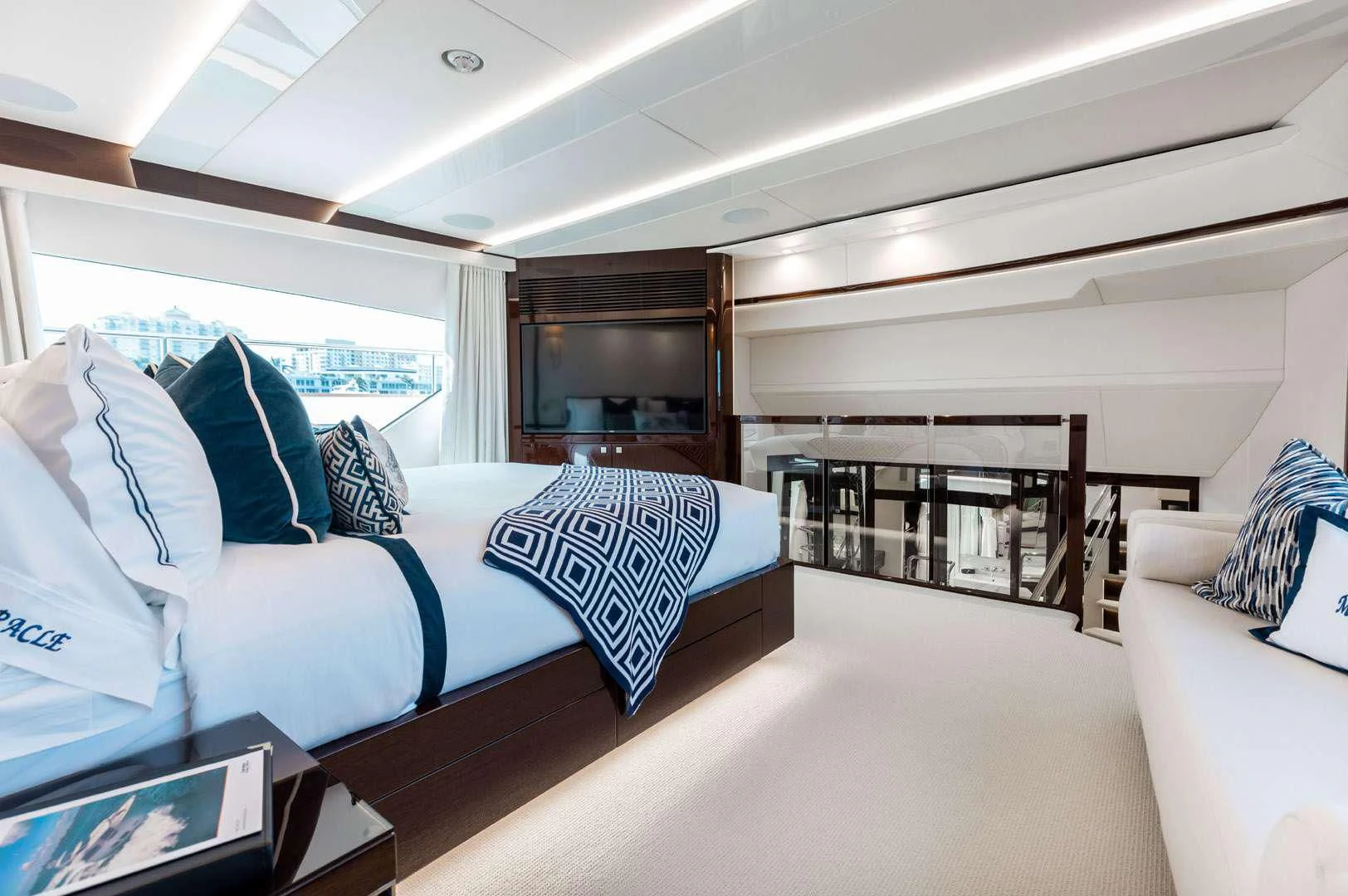 a room with a bed and a window aboard MIRRACLE Yacht for Sale