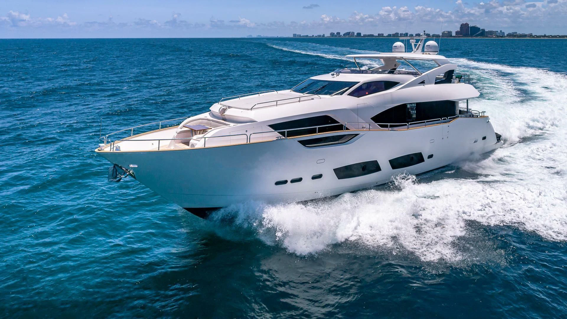 a white yacht on the water aboard MIRRACLE Yacht for Sale