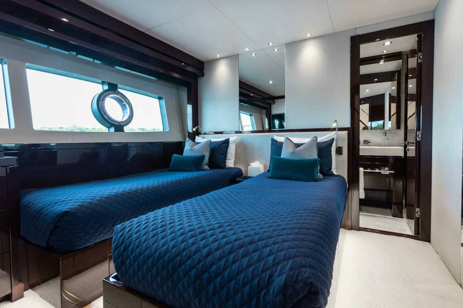a room with a bed and a window aboard MIRRACLE Yacht for Sale