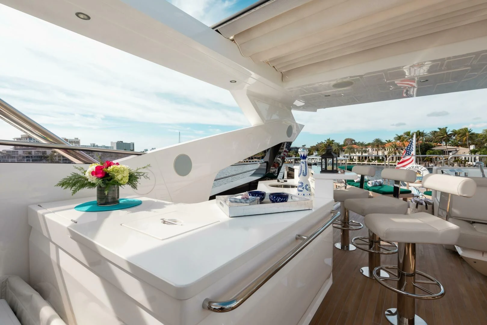 a room with a large white table and chairs and a large window aboard MIRRACLE Yacht for Sale