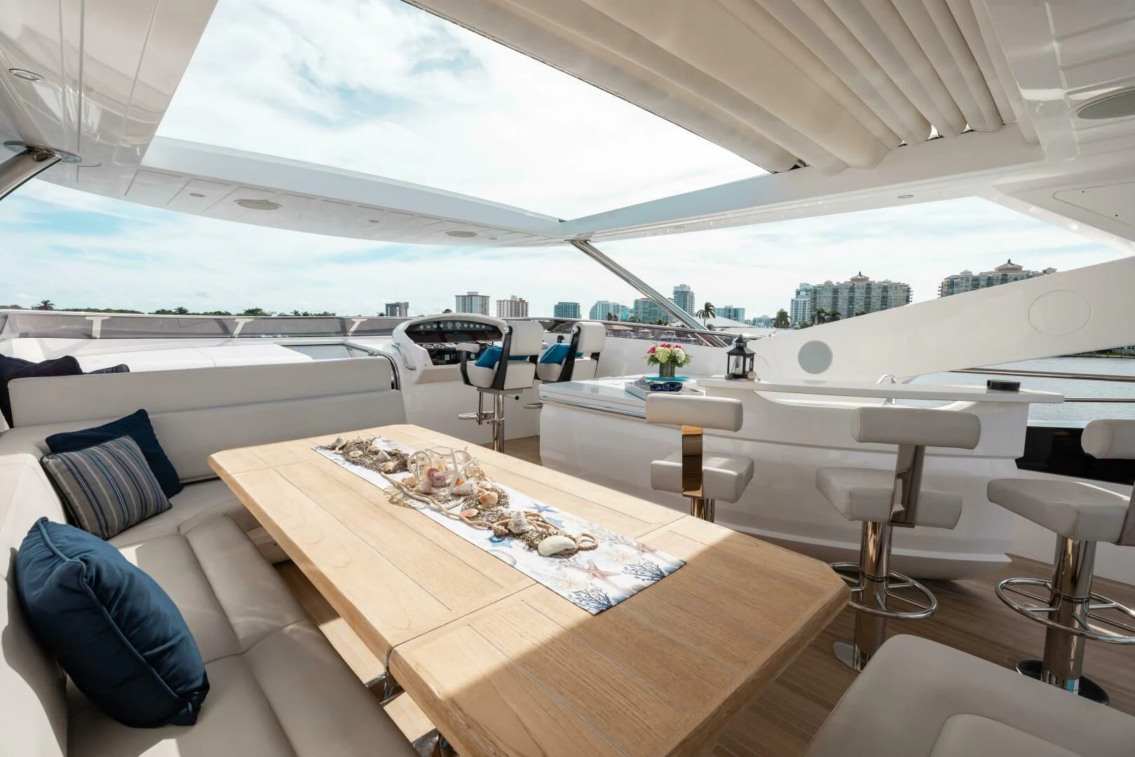 a room with a table and chairs aboard MIRRACLE Yacht for Sale