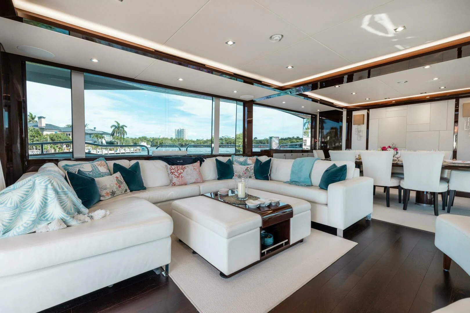 a living room with a large window aboard MIRRACLE Yacht for Sale