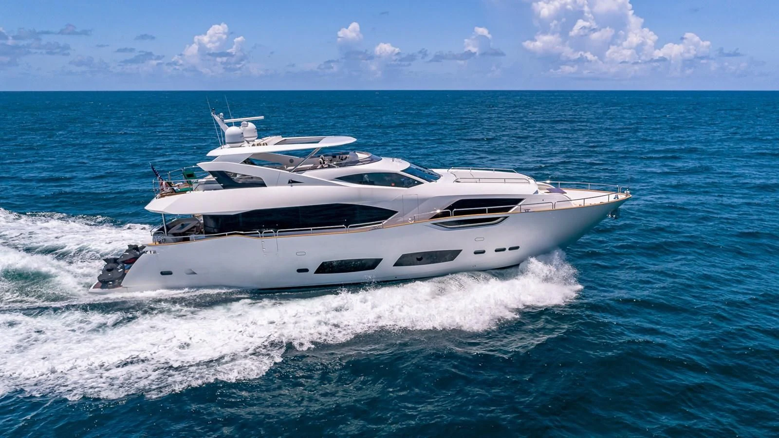 a white yacht on the water aboard MIRRACLE Yacht for Sale