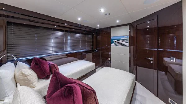 a room with a bed and a closet aboard MIRRACLE Yacht for Sale