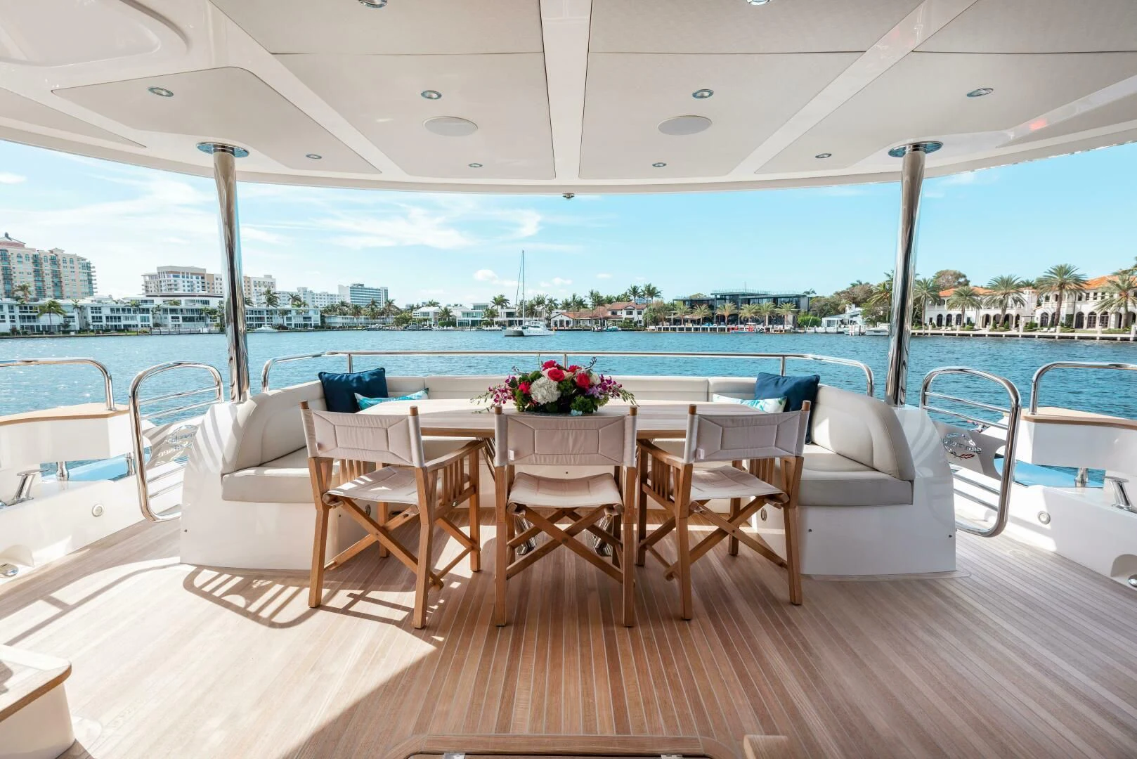 a table and chairs on a deck aboard MIRRACLE Yacht for Sale
