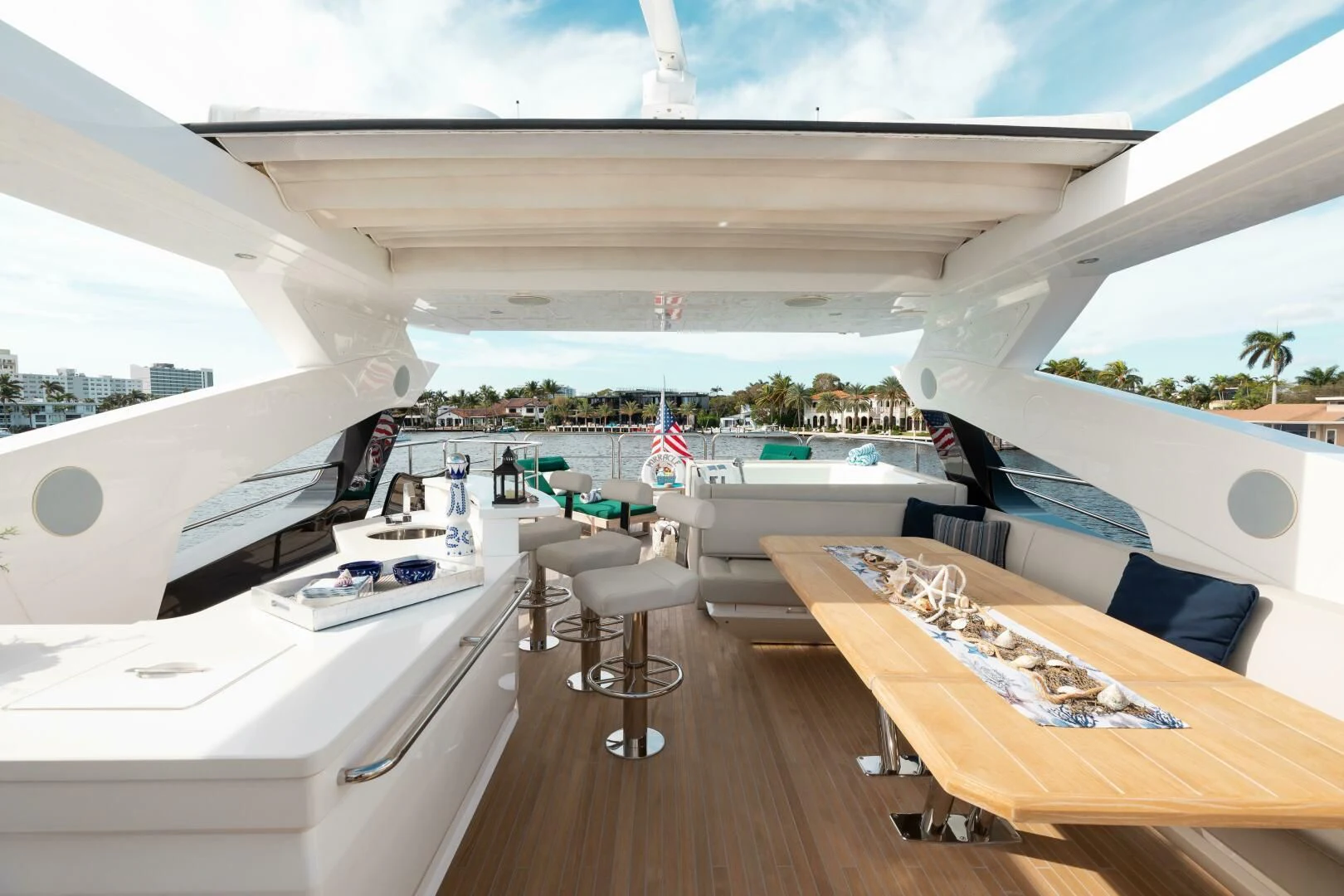a room with a large white tent and a table with chairs aboard MIRRACLE Yacht for Sale