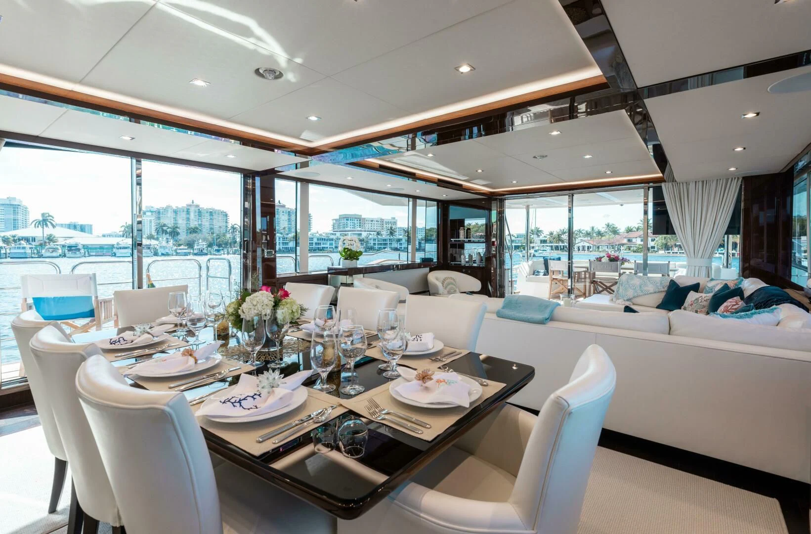 a dining room with a large window aboard MIRRACLE Yacht for Sale