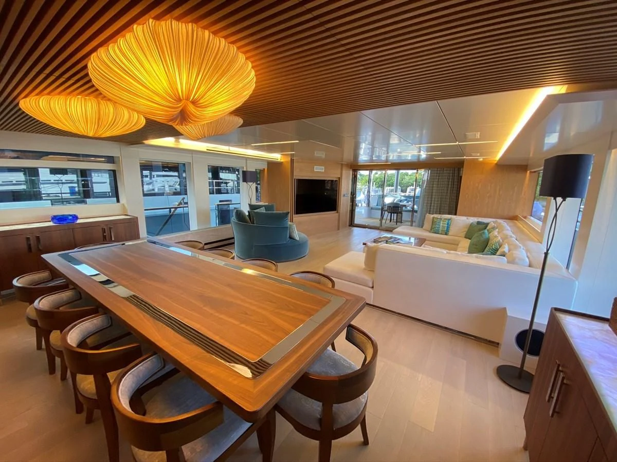 a room with a table and chairs aboard PERSISTENCE Yacht for Sale