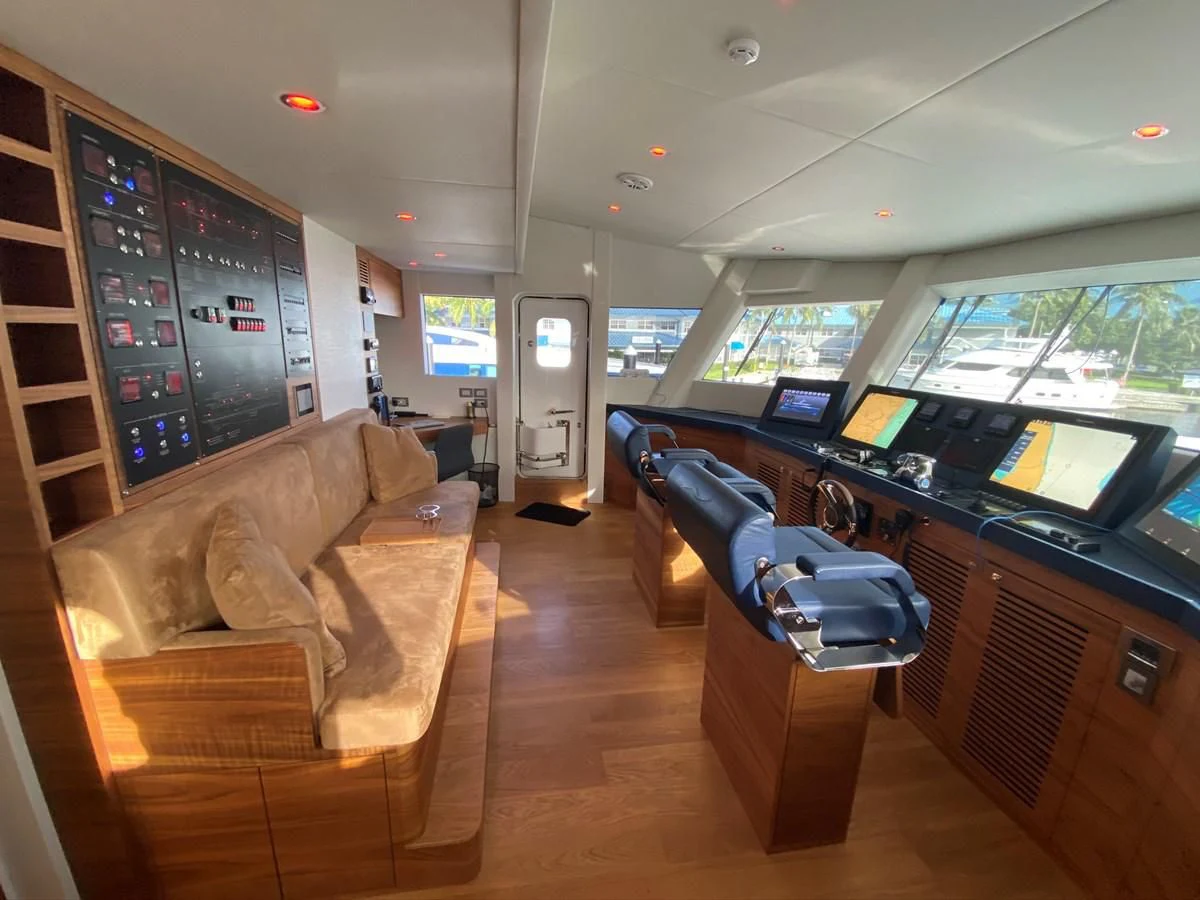 a living room with a couch and a tv aboard PERSISTENCE Yacht for Sale