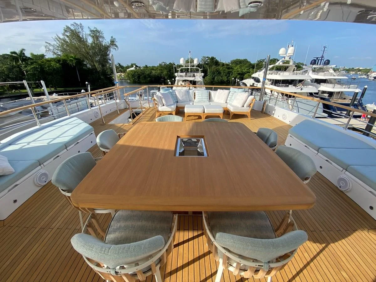 a table with chairs on it aboard PERSISTENCE Yacht for Sale