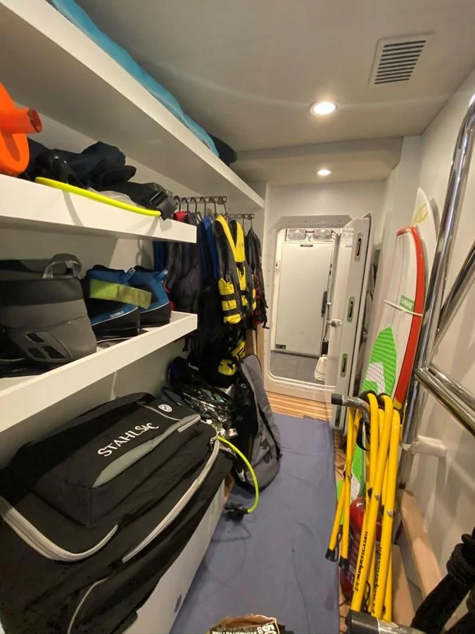 a vehicle with clothes on the rack aboard PERSISTENCE Yacht for Sale