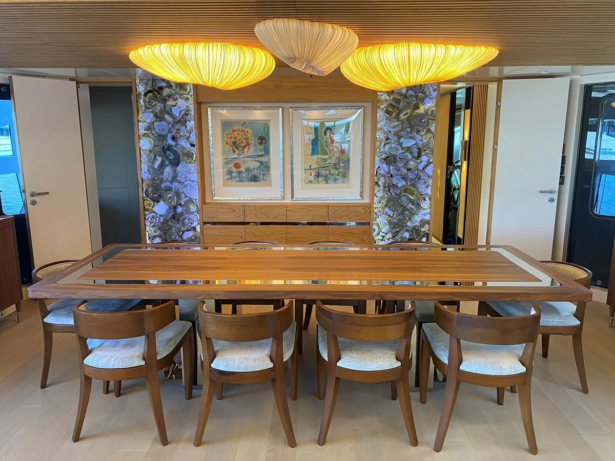 a group of chairs around a table aboard PERSISTENCE Yacht for Sale