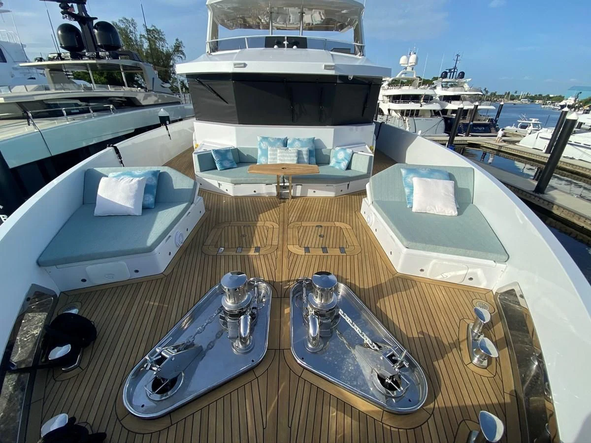 a deck with a boat and a couple of boats on it aboard PERSISTENCE Yacht for Sale