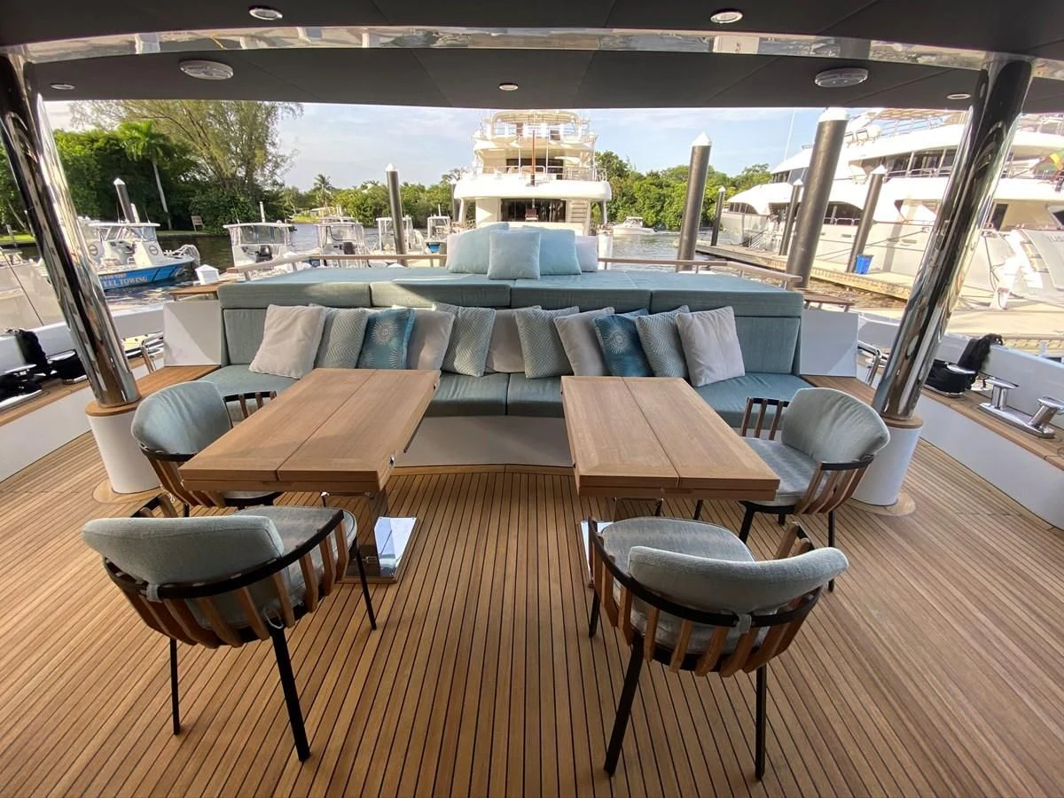 a table with chairs around it aboard PERSISTENCE Yacht for Sale