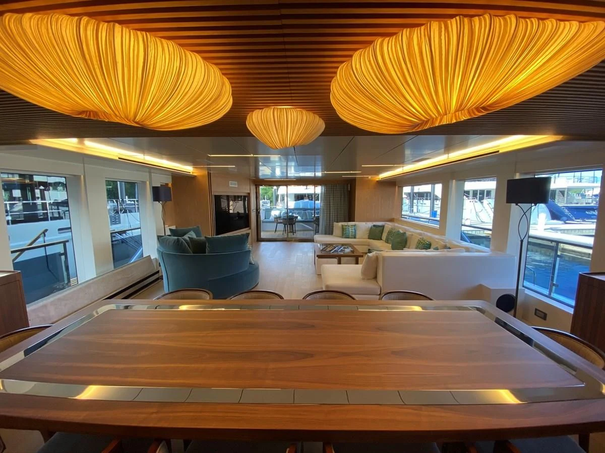 a room with a wood floor and a large window with a wood floor aboard PERSISTENCE Yacht for Sale