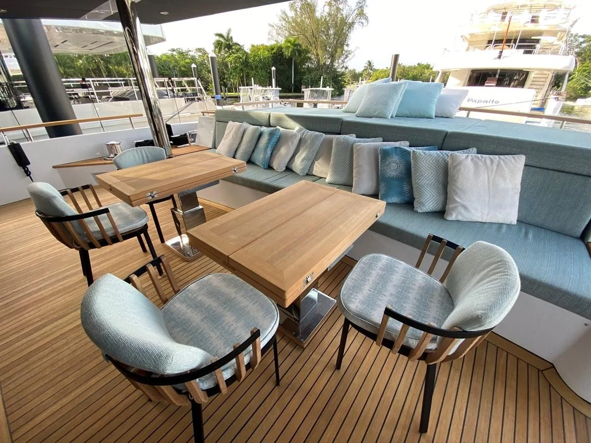 a living room with a couch and a table aboard PERSISTENCE Yacht for Sale