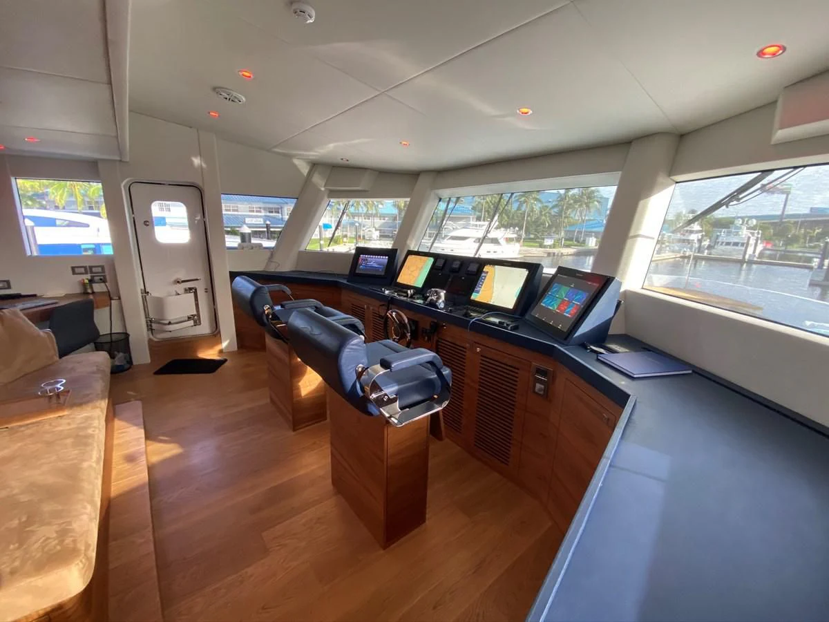 a room with a desk and a laptop aboard PERSISTENCE Yacht for Sale