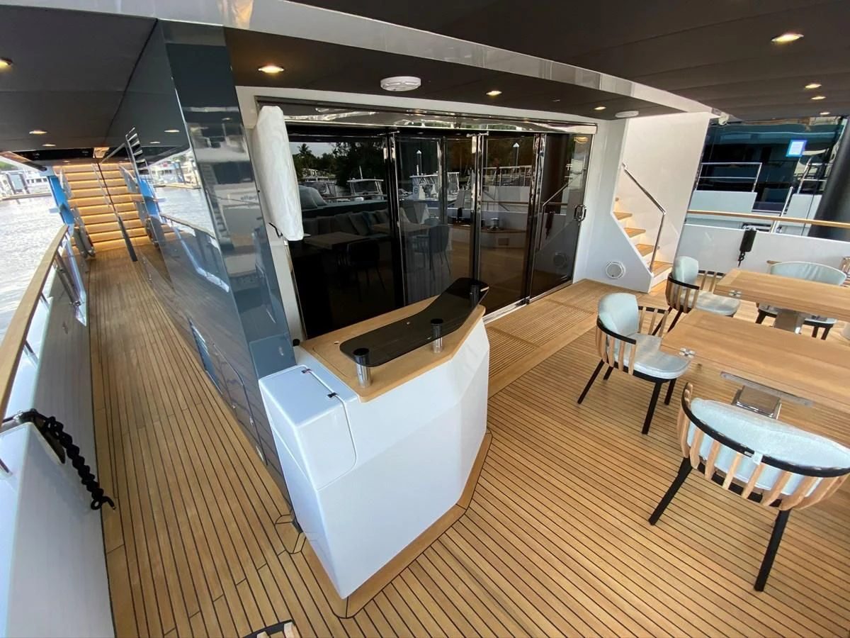 a large room with chairs and tables aboard PERSISTENCE Yacht for Sale
