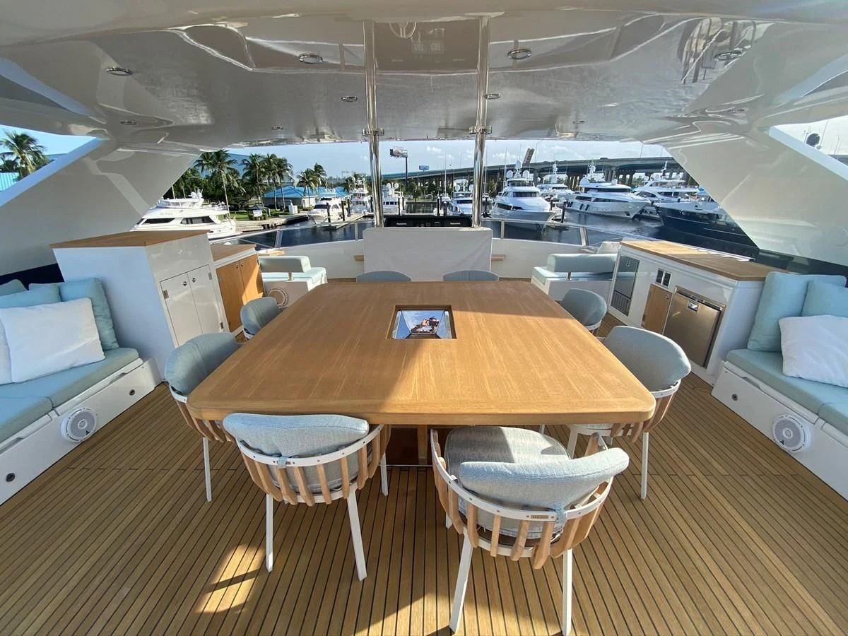 a room with a table and chairs aboard PERSISTENCE Yacht for Sale
