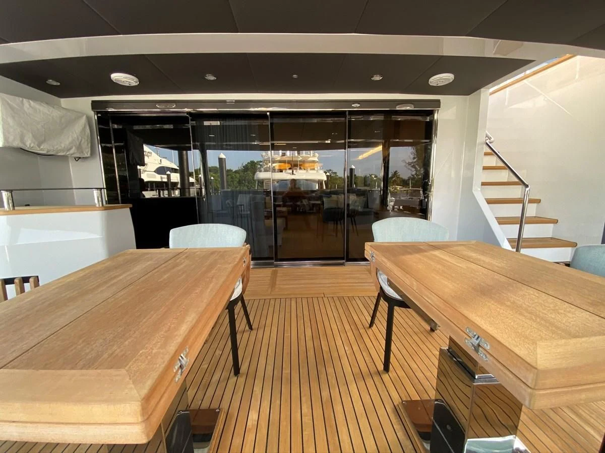 a room with a table and chairs aboard PERSISTENCE Yacht for Sale