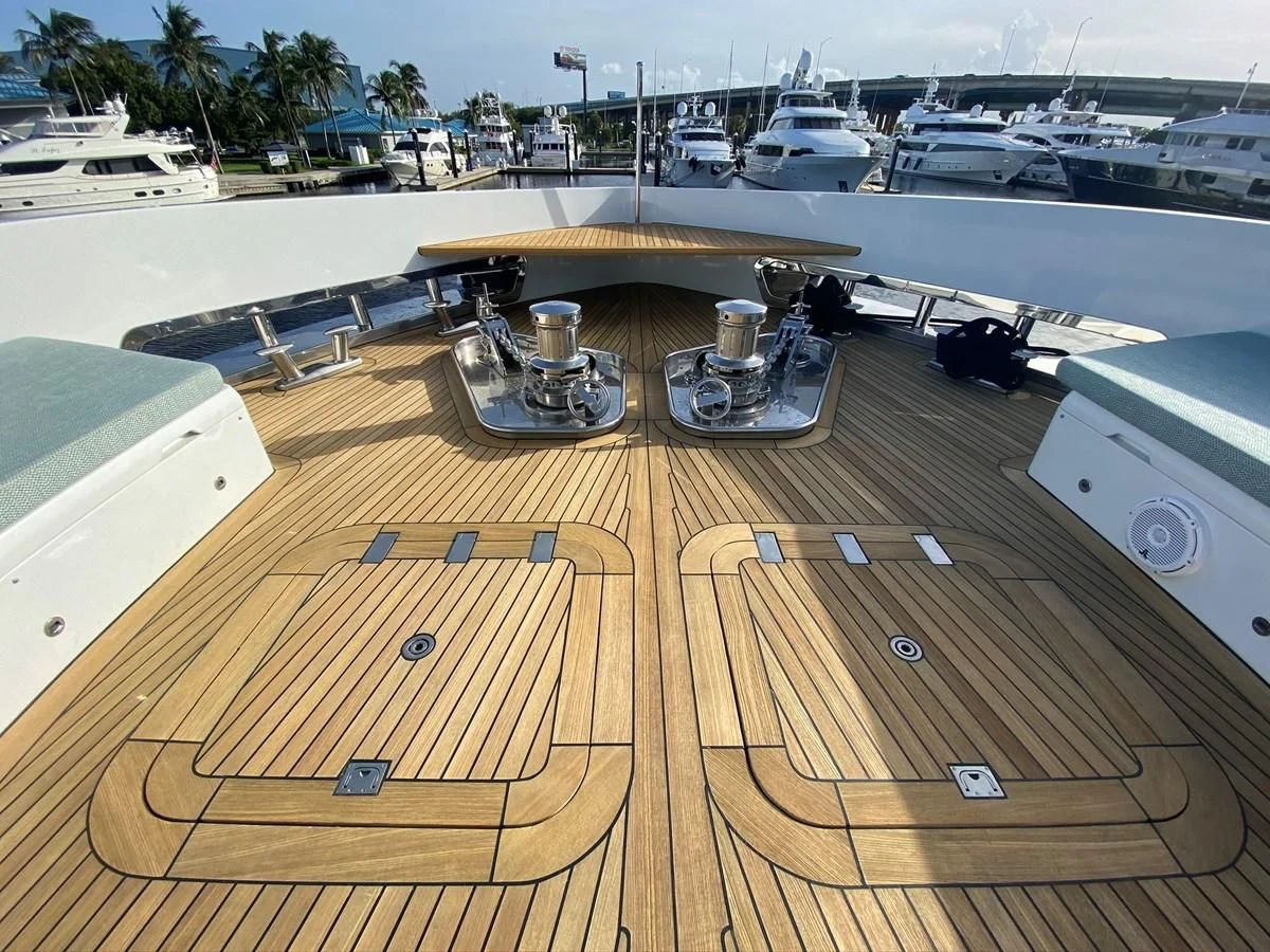 a wooden deck with a large metal object on it aboard PERSISTENCE Yacht for Sale