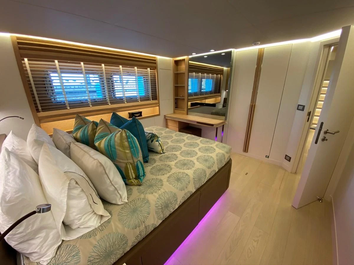 a bed in a room aboard PERSISTENCE Yacht for Sale
