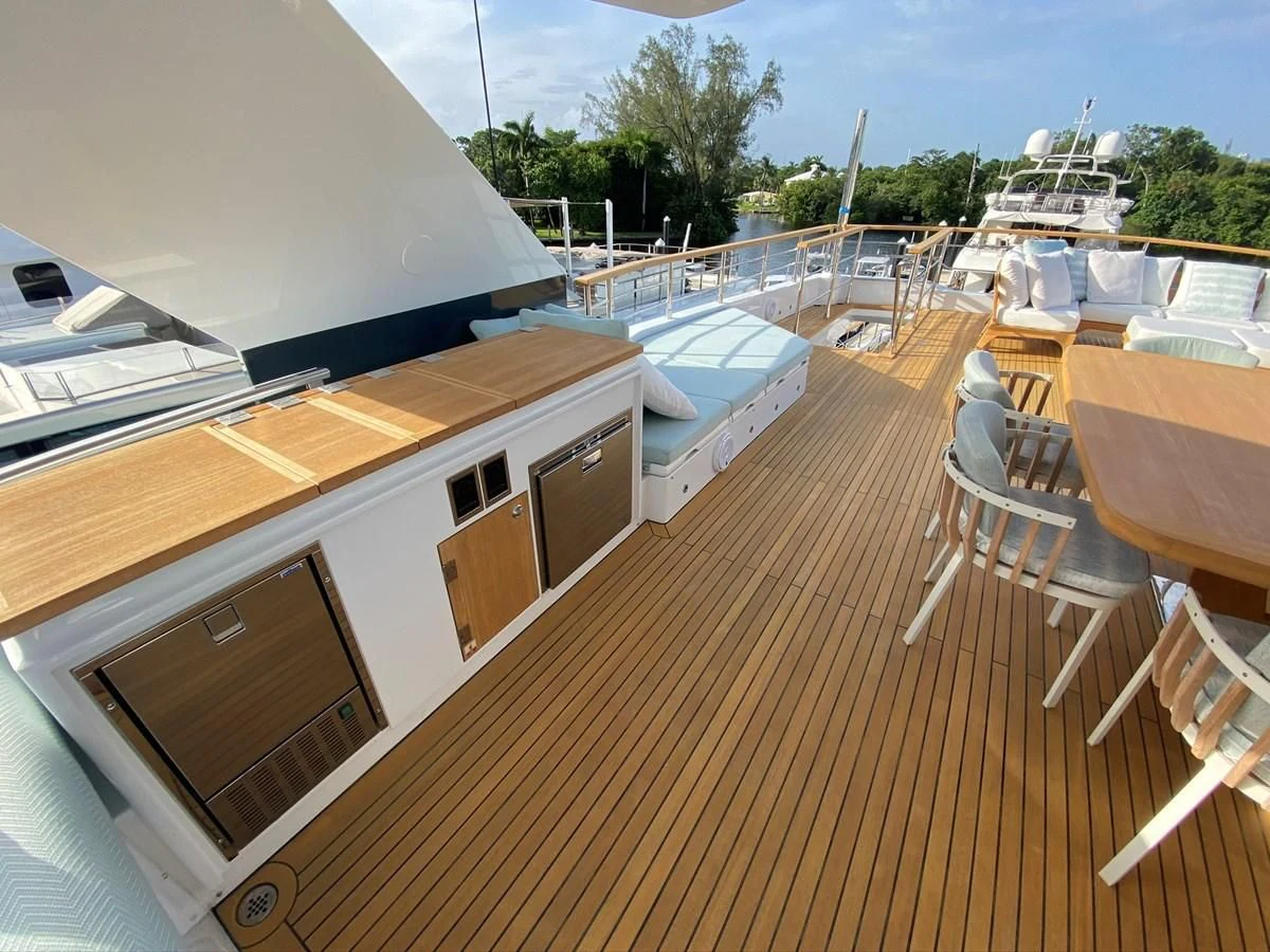 a deck with a deck and chairs aboard PERSISTENCE Yacht for Sale