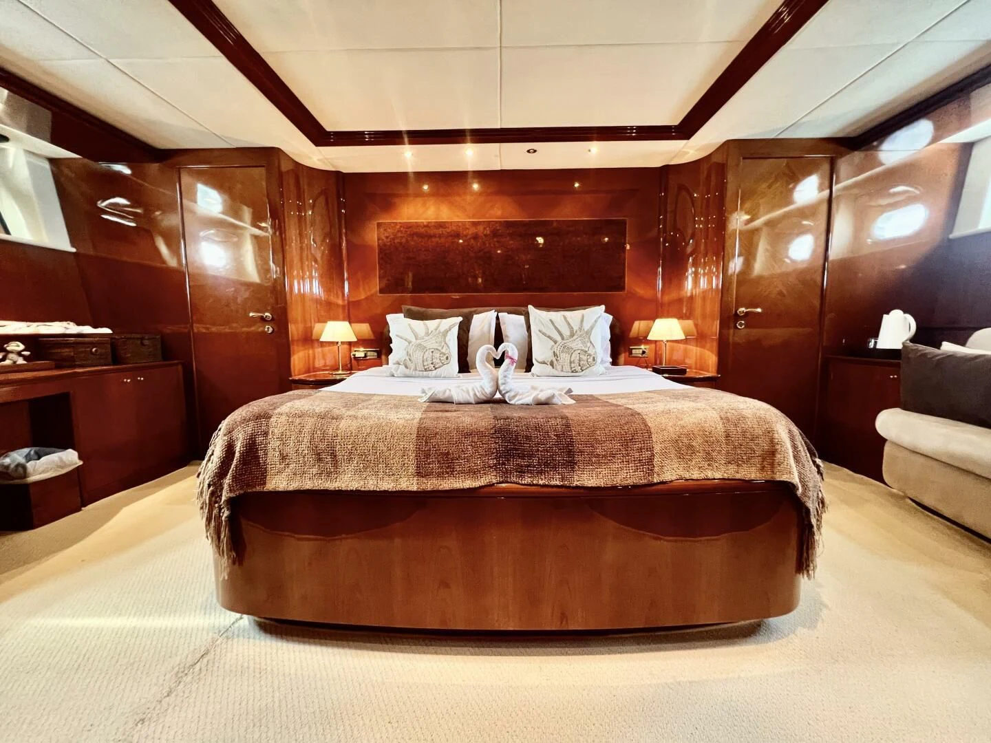 a bed with a dog on it aboard GARI Yacht for Sale