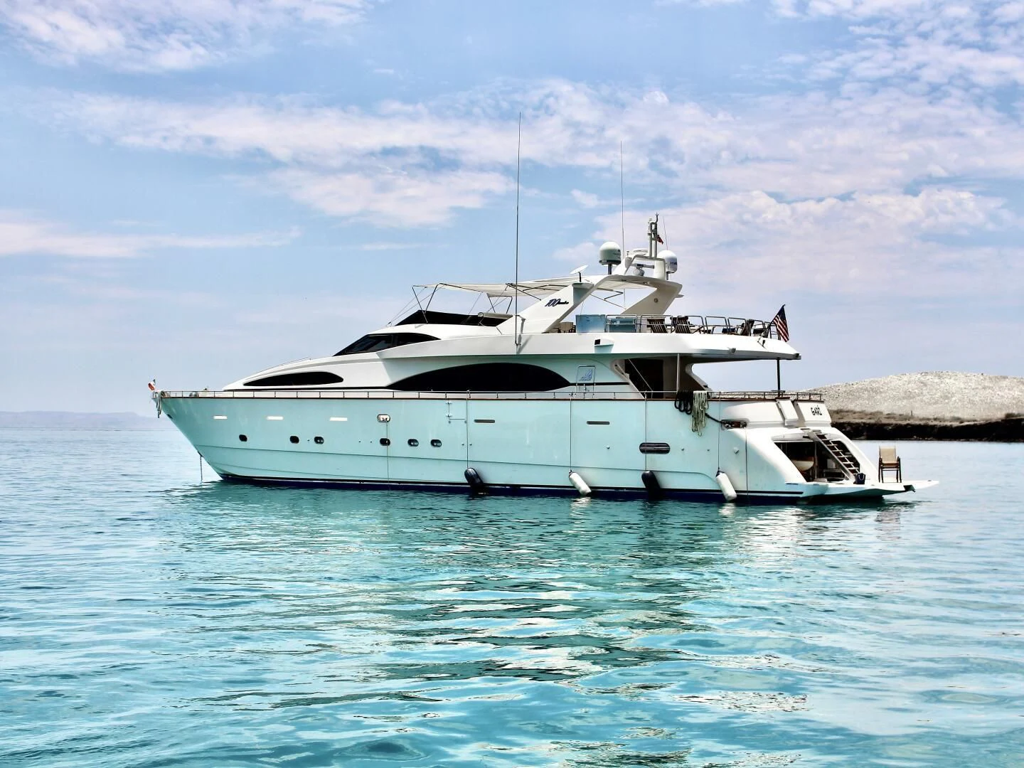 a white boat in the water aboard GARI Yacht for Sale