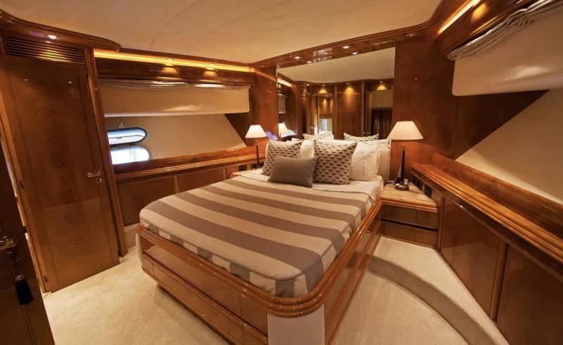 a room with a bed and a mirror aboard TIFFANY Yacht for Sale