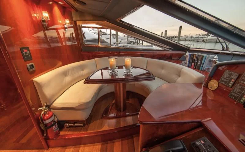 a room with a couch and a table with drinks on it aboard TIFFANY Yacht for Sale