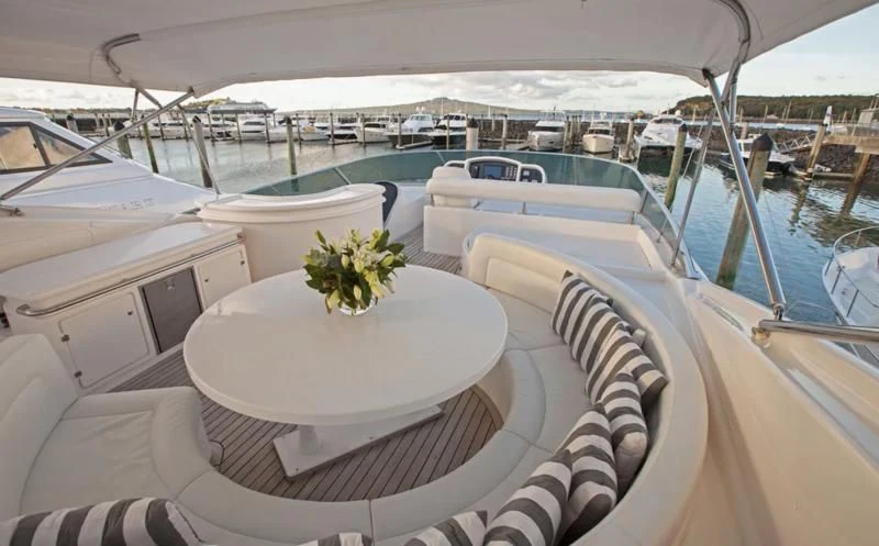 a boat with a table and chairs on it aboard TIFFANY Yacht for Sale