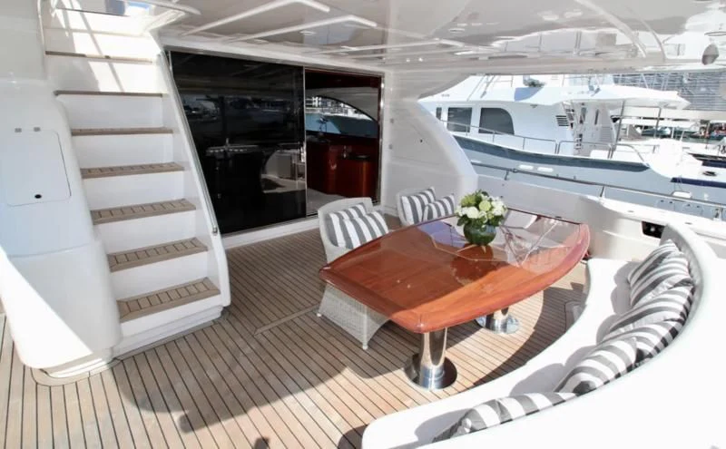 a table and chairs in a room aboard TIFFANY Yacht for Sale