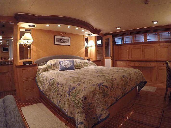 a large bed in a room aboard BELLA Yacht for Sale