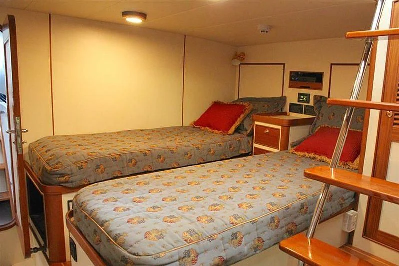 a bed in a room aboard BELLA Yacht for Sale