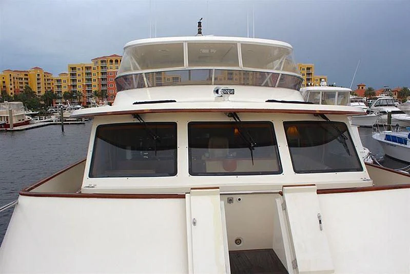 a white yacht in a harbor aboard BELLA Yacht for Sale