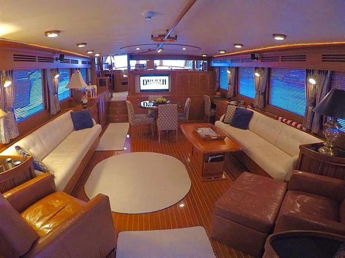a living room with a large screen aboard BELLA Yacht for Sale