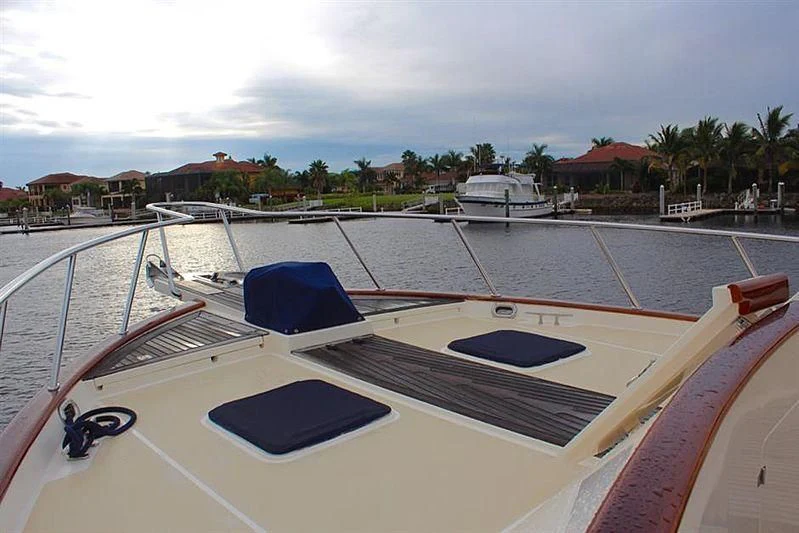 a large white boat with a blue roof aboard BELLA Yacht for Sale