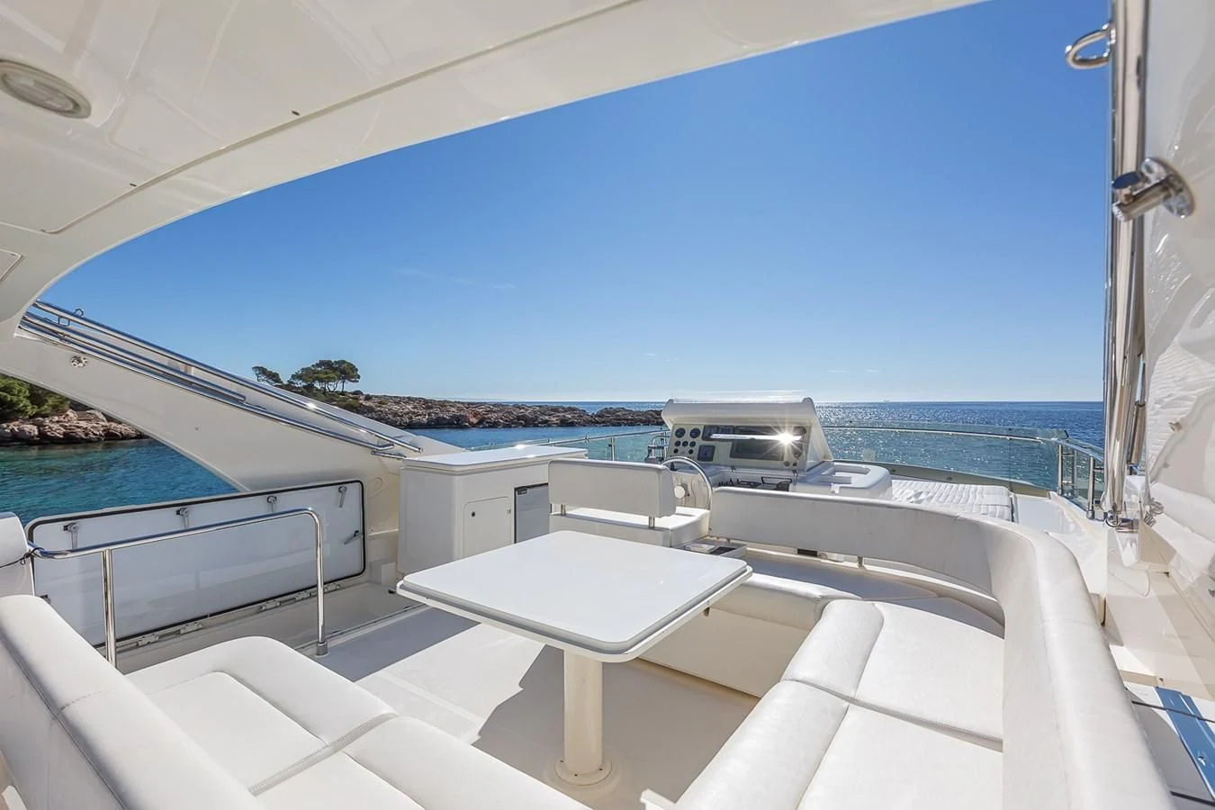 a pool with a view of the ocean and the beach aboard BIJOU Yacht for Sale