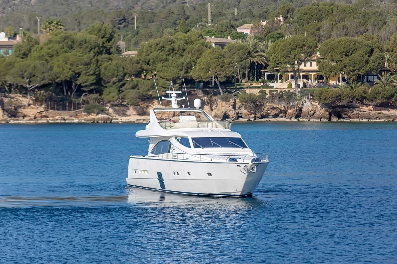 a white boat on the water aboard BIJOU Yacht for Sale