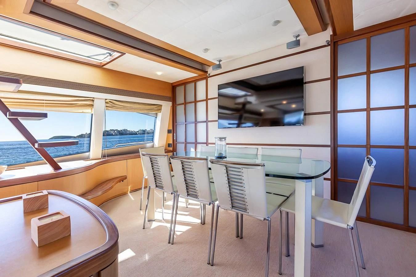 a room with a table and chairs aboard BIJOU Yacht for Sale