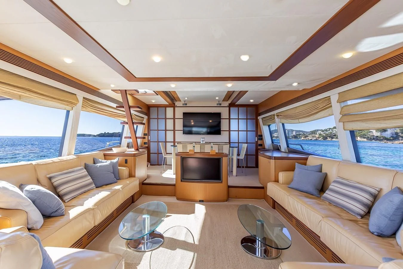 a living room with a fireplace aboard BIJOU Yacht for Sale