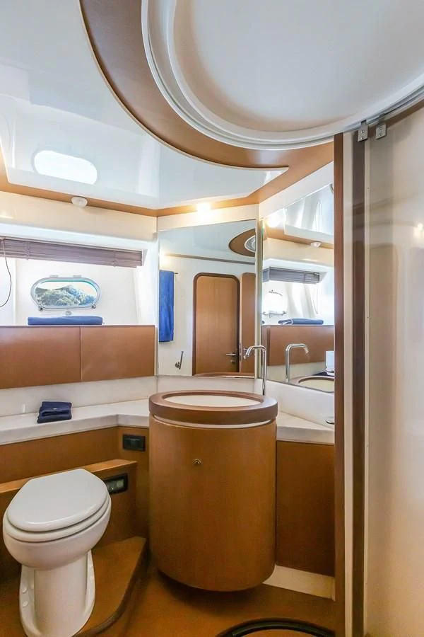 a bathroom with a toilet and sink aboard BIJOU Yacht for Sale