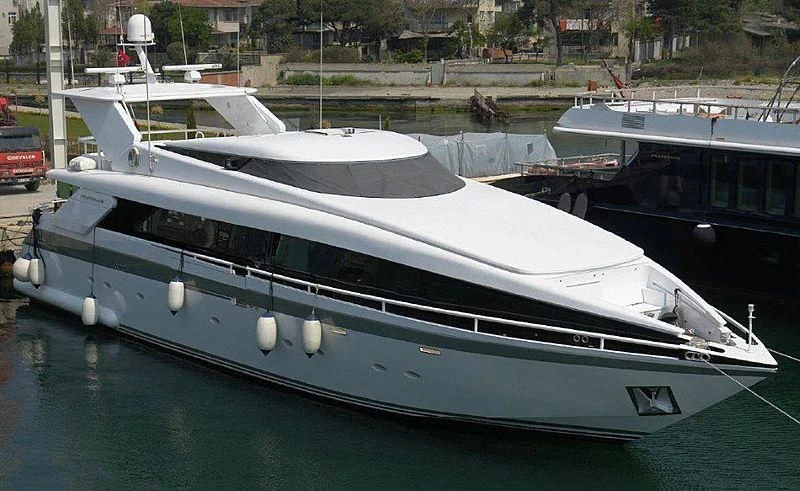 a boat docked at a pier aboard MOONTAZZAM II Yacht for Sale