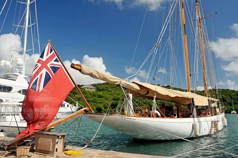 a boat with a flag on it aboard ALTAIR Yacht for Sale