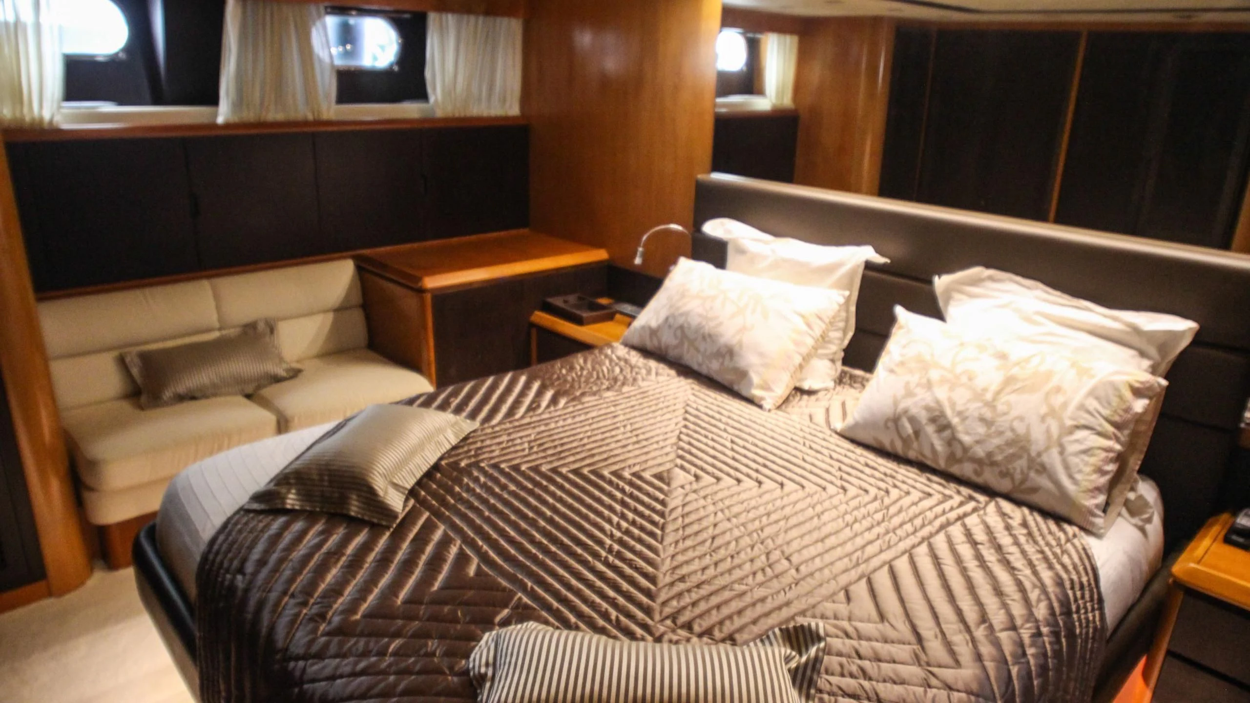 a bed with white pillows aboard CIRCUS Yacht for Sale