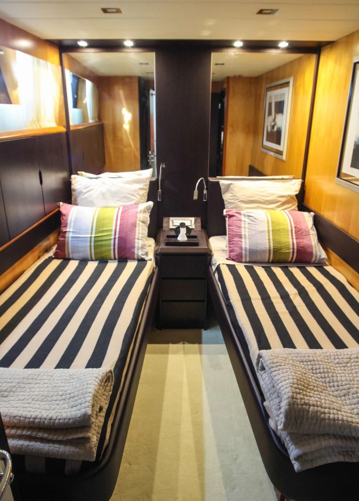 a room with a bed and a mirror aboard CIRCUS Yacht for Sale